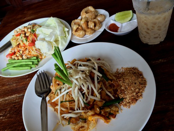 I was feeling really hungry, and probably because I felt so comfortable surrounded by roman alphabets instead of Thai sanskrit, I ordered a Phat Thai, a Song Tham (papaya salad) and a tall glass of iced coffee. Too. Much. Food. *burp!*