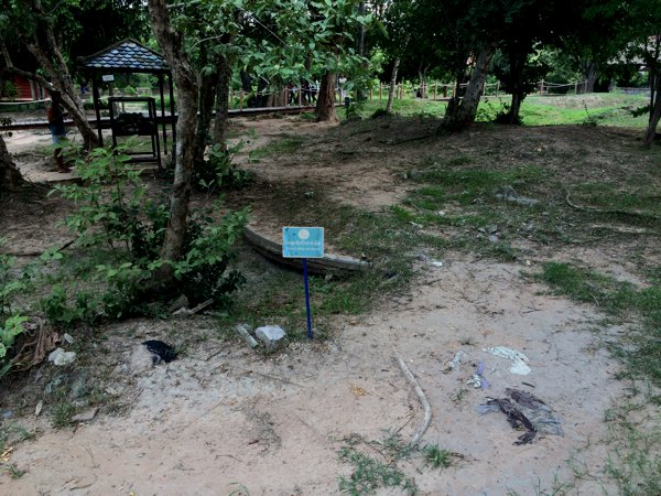 One of the many mass burial sites in Choeung Ek. You can still spot bone fragments and cloth - possibly from the clothing of the buried - here.