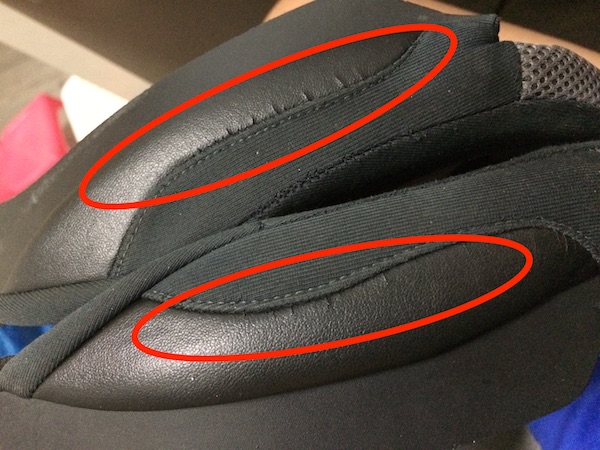 The faux leather on the cheek pads is showing signs of cracking.